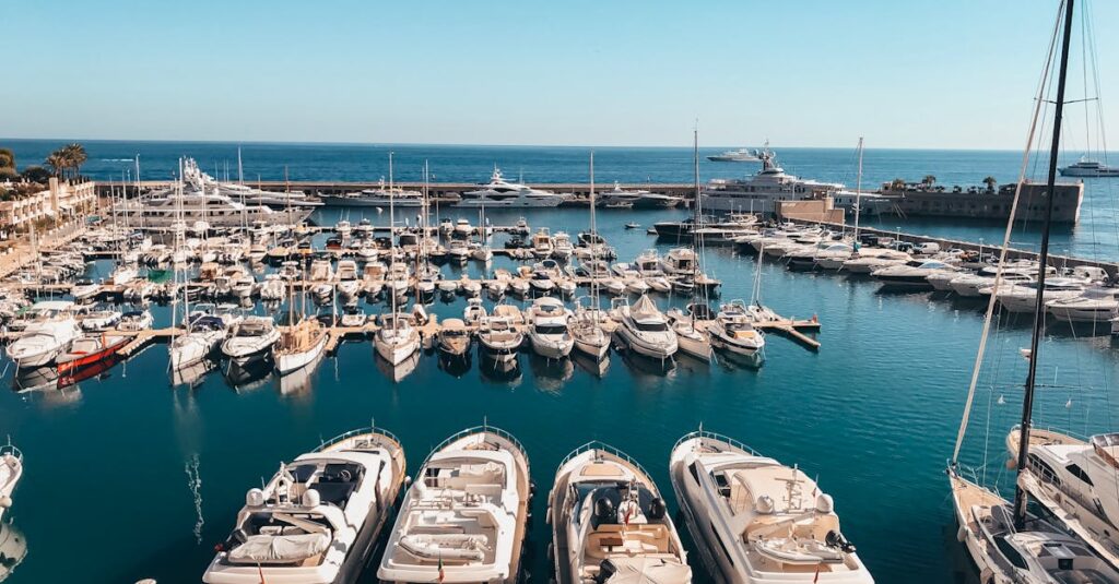 A stunning view of luxury yachts in the vibrant Monaco harbor under a clear sky.